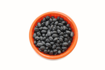 Dry Black Beans in an Orange Bowl Over White