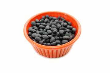 An Orange Bowl Filled with Dry Black Beans