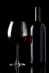 Red wine isolated on black