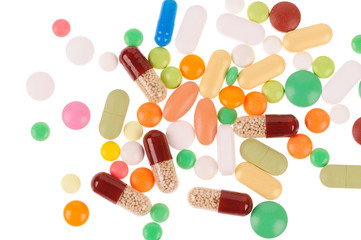 Heap of pills on white background