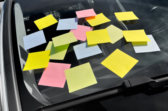 Eighteen Sticky Notes on a Windshield