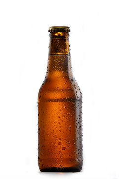 Cold bottle of beer on white background