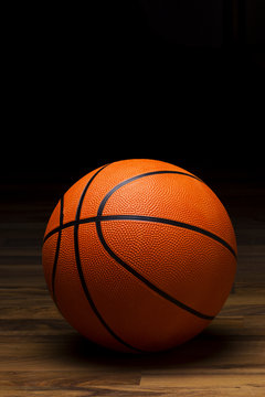 Basket ball sitting on wood floor