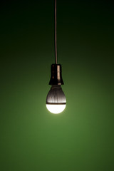LED bulb on green background