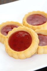 Sour and sweet strawberry jam in soft delicious tartlet