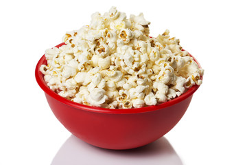 Red bowl with popcorn isolated on white