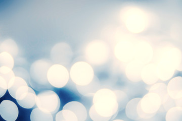 Festive blur background with natural bokeh and bright silver lig