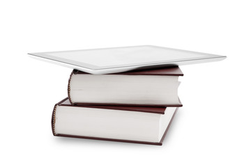 blank digital tablet and stack of books