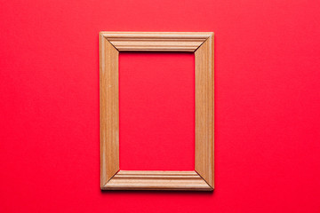 wooden frame on red background