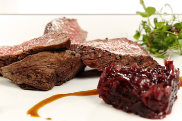 Medium done meat steak with sweet red onion