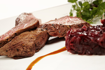 Medium done meat steak with sweet red onion
