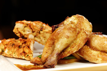 Young baked chicken served on plate with traditional stuffing
