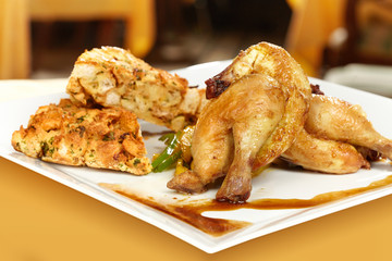 Baked little chicken served on plate with traditional stuffing