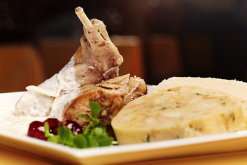 Roasted rabbit leg with Czech dumplings and white cream sauce