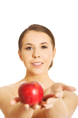 Nude woman holding an apple