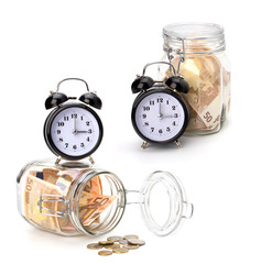 Money accumulation concept. Money and alarm clock isolated on wh