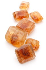 Brown caramelized lump cane sugar cube isolated on white backgro