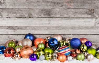 Obraz na płótnie Canvas Assorted Christmas Balls Decorations on Snow