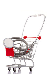 Shopping cart with a stethoscope, isolated on white background