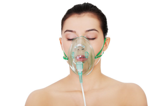 Diseased female with an oxygen mask