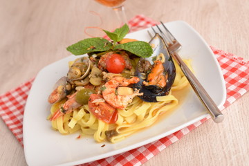 Fototapeta na wymiar PASTA DI FETTUCINE AL PESCE - Fettucine pasta FISH