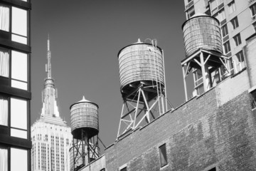 Water towers atop buildings and Empire State Building