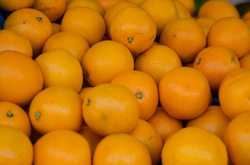 Fototapeta premium Bunch of Oranges for sale at an outdoor market