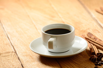 Coffee cup and coffee beans around
