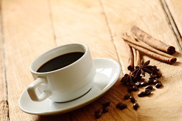 Coffee cup and coffee beans around