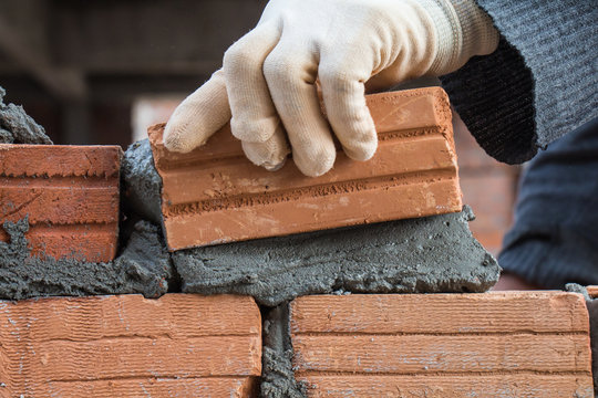 Building brick block wall on construction plant