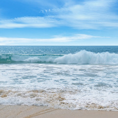 ocean, sandy beach and blue sky