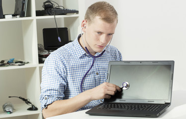 Fototapeta na wymiar Computer specialist with stethoscope
