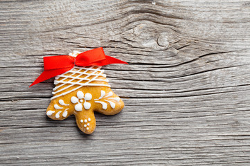 Gingerbread cookie on wooden background. Christmas