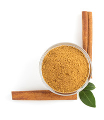 cinnamon sticks and powder on white