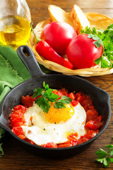 Scrambled eggs with roasted tomatoes.