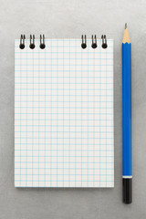 checked notebook at metal background