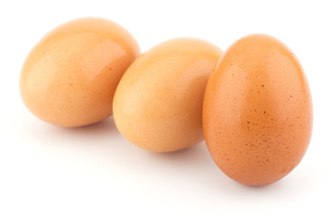 Chicken eggs closeup isolated on white background