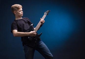 Fototapeta premium Rock musician is playing electrical guitar.