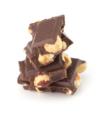 Stack of chocolate pieces with nut isolated on white background