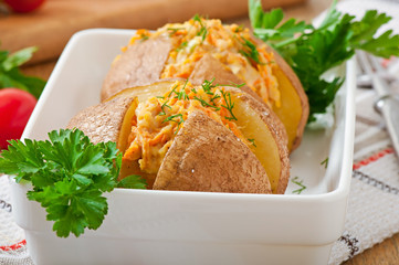 Baked potatoes stuffed with minced chicken and carrots