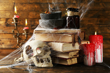 Frightful still life for Halloween, on wooden background