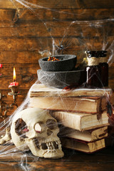 Frightful still life for Halloween, on wooden background