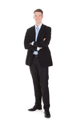Full Length Portrait Of Confident Young Businessman