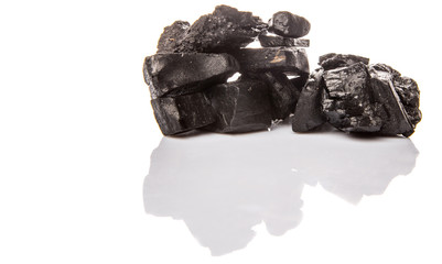 Obraz premium Lump of charcoal over white background