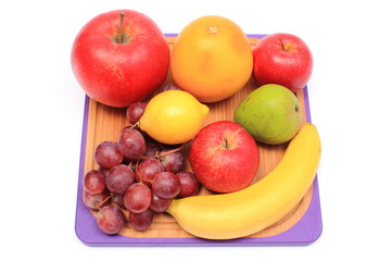 Naklejka na ściany i meble Fresh natural fruits on cutting board