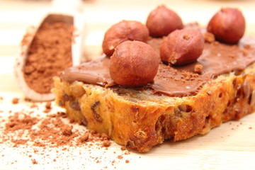Hazelnut and slices of bread with chocolate cream