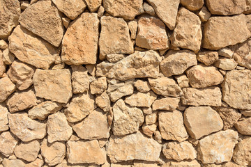 Texture - a wall of bright blocks of limestone.