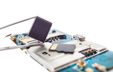 dismantle the phone and tweezers with a chip