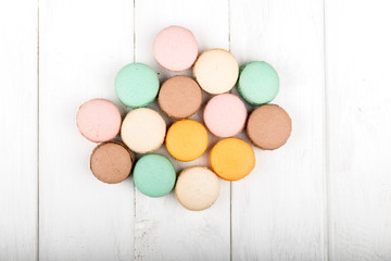 Set of macarons on white wooden table