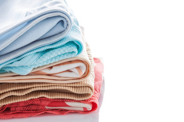 Closeup stack of female underwear on the white.